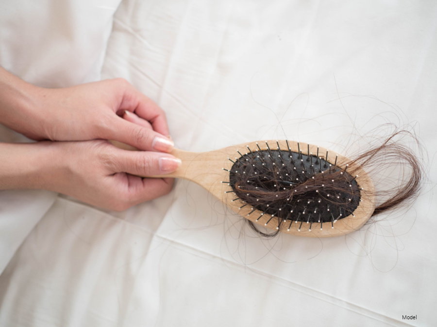 hair brush with hair stuck in it